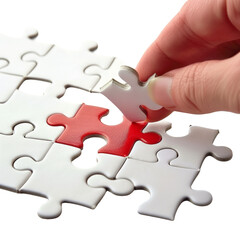 Fototapeta premium A hand placing the final piece of a puzzle with a red center. Concept of problem-solving, completion, and teamwork.