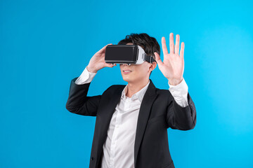 Asian businessman looking thorough VR while touching screen with connecting business world report...