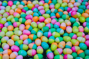 Full frame shot of multicolored charity raffle balls are floating in the tub