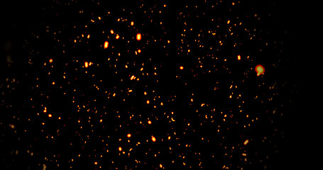 Realistic surreal ember fire dust slowing rising up on black bg. Grunge dark fire sparks flying isolated dark background. Overlay spark tiny flake burning. Hell rising burst inferno. Ember on black.