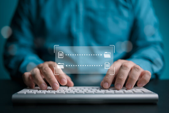 Data Synchronize Transfer, move or copy data files between server. Back up sync data, Exchange files in cloud, Send documents to cloud. Man use keyboard with virtual document load to another folder.