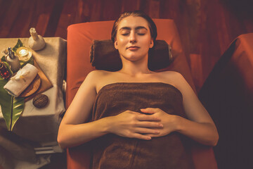 Top view woman customer enjoying relaxing anti-stress spa massage and pampering with beauty skin...