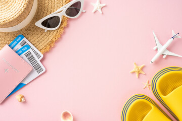 Flat lay of summer travel essentials including a passport, boarding pass, sunglasses, hat, and sandals on a pink background