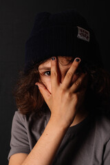 portrait of a boy with black nails