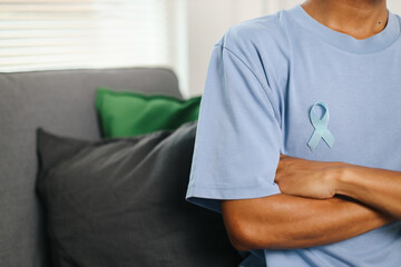 Man Crossed Arms With Light Blue Ribbon, Prostate Cancer Awareness, Men Health Awareness, World...