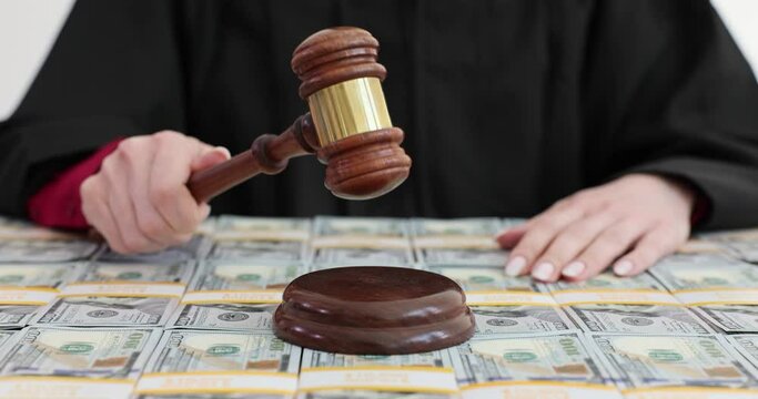 Judge gavel and a stack of hundred dollar bills