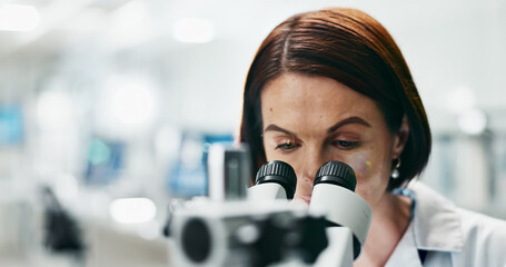 Woman, scientist and forensic with microscope for discovery, research or breakthrough at...