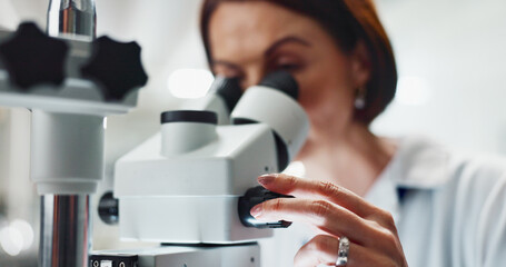 Hands, woman and scientist by microscope with research for cancer treatment at pharmaceutical lab....
