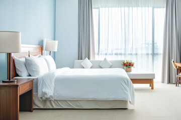 Elegant hotel room interiors with modern furniture and copyspace. Interior design composition soft tones.