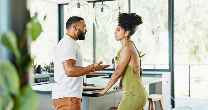 Divorce, crisis and couple argue in a kitchen with stress, anger and cheating confrontation at home. Marriage, conflict or frustrated people in a house with doubt, disaster or gaslighting disaster
