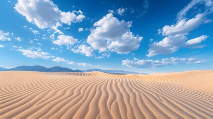 Naklejka premium Realistic photo of the desert dunes with blue sky and white clouds.