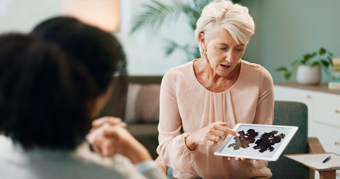 Therapist, patient and inkblot test in therapy for psychology analysis and mental health assessment on tablet. Psychologist, senior woman and digital tech with rorschach image for emotional disorder - Powered by Adobe