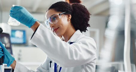 Glass beaker, goggles and woman scientist in laboratory for medical study, research or experiment....