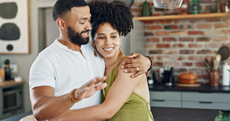Kitchen, talking and couple hug in home for bonding, loving relationship and commitment together. Happy, marriage and man and woman embrace for affection, romance and love for new house or apartment