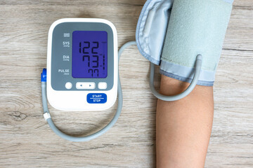 Man check blood pressure monitor and heart rate monitor with digital pressure gauge. Health care...