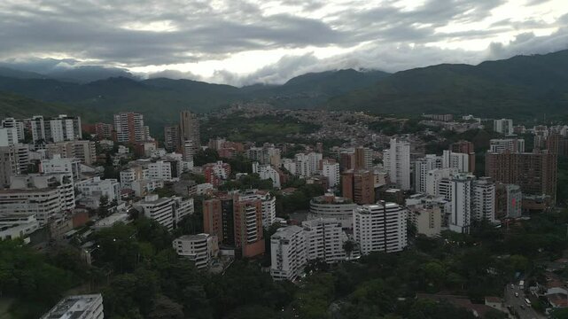 Aerial View of Western Cali, Santa Teresita Neighborhood, Colombia. Pull Back Shot with Aguacatal Neighborhood in the Background