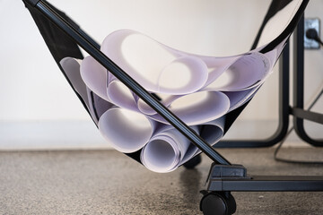 Printed blueprints in plotter printer basket