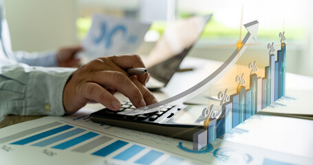 calculate finances Analytics Businessman's hands typing on a laptop keyboard in a modern office...