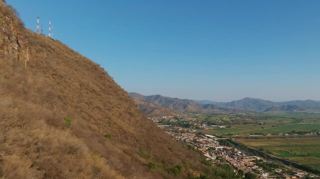 Proximity flight of Cerro de la Mesa mountain overlooking the Mexican town Tamazula