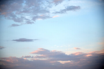 view of the blue sky at sunset with pink clouds