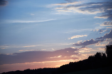 view of the blue sky at sunset with pink clouds