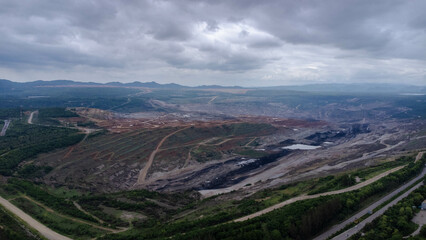 Aerial view of a cement bridge under construction. Road currently under construction at several levels to increase traffic