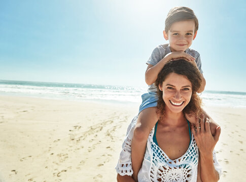 Portrait, mother and son piggy back for holiday, fun and together with child for Australia adventure. Summer, ocean and travel vacation afternoon with happy woman, boy and kid for shoulder ride - Powered by Adobe