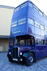 Fototapeta premium JAPAN - Nov 13, 2023: A blue double decker bus labeled Knight Bus featured in the Harry Potter series parked on a paved area at Warner Bros. Studio Tour Tokyo, The Making of Harry Potter