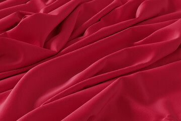 Fototapeta premium A detailed close-up shot of red fabric with soft folds and creases, creating a textured and elegant background.