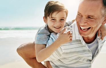 Happy, piggyback and grandfather with child at beach for summer, fun and bonding on vacation in...