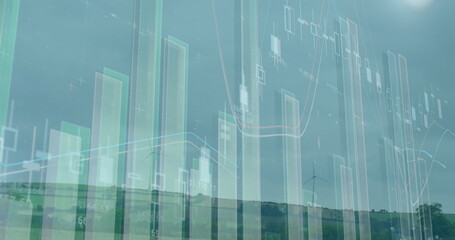 Image of graphs and financial data over wind turbine