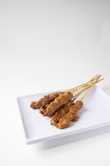 sate kambing, indonesian satay on a plate isolated