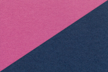 Texture of craft magenta and navy blue paper background, half two colors, macro. Vintage kraft purple cardboard.