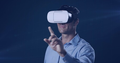 Image of caucasian man wearing vr headset over dark background