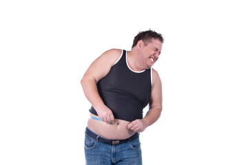 Fototapeta premium Fitness and healthy lifestyle. Funny fat guy on a diet. White background.