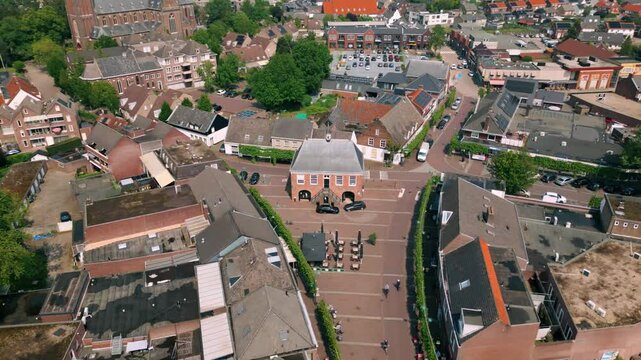 Aerial view of Budel's Markt street, showcasing De Schout and the charming townscape of Brabant's Cranendonck area. Location: Budel, Netherlands