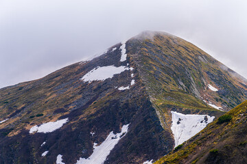 Landscape with Mount Hoverla hanging peak of the Ukrainian Carpathians against the background of the sky and clouds