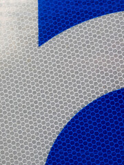 Close-up blue and white hexagonal shapes on metal background. Abstract background
