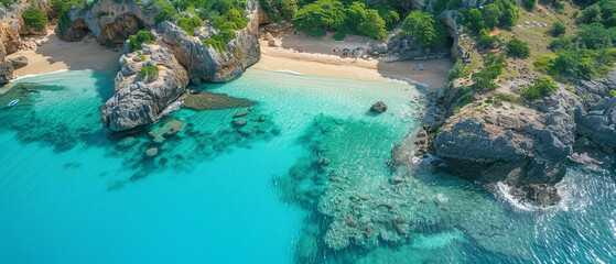 Serene Secluded Beach Cove with Rocky Cliffs and Crystal-Clear Waters from Aerial View