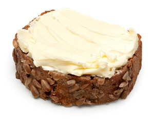 freshly baked dark bread with butter isolated on white background. clipping path