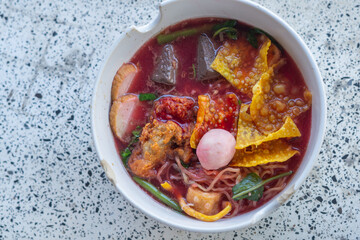Large Yen Ta Fo Noodles on the Dining Table for Lunch. Large Noodles in Pink Soup