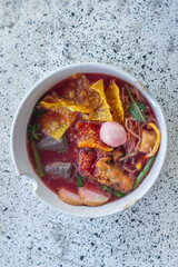 Large Yen Ta Fo Noodles on the Dining Table for Lunch. Large Noodles in Pink Soup