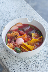 Large Yen Ta Fo Noodles on the Dining Table for Lunch. Large Noodles in Pink Soup