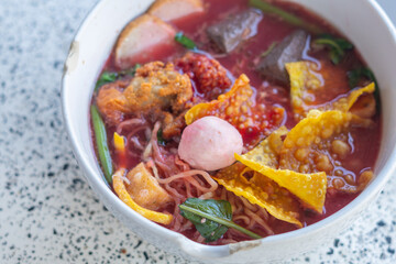 Large Yen Ta Fo Noodles on the Dining Table for Lunch. Large Noodles in Pink Soup
