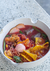 Large Yen Ta Fo Noodles on the Dining Table for Lunch. Large Noodles in Pink Soup