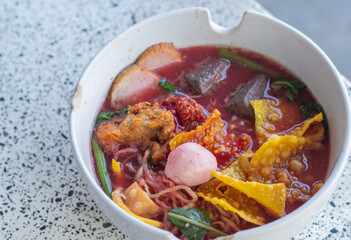 Large Yen Ta Fo Noodles on the Dining Table for Lunch. Large Noodles in Pink Soup