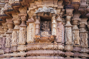 Ancient architectural stone carvings of Mandakini Temple with intricate artistry and historical importance