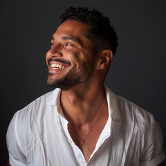 Obraz premium Attractive giggling Latin man looking away during mid-day 