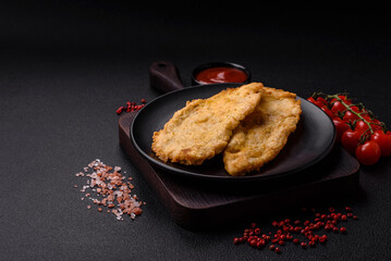 Delicious juicy chicken chops in batter with salt, spices and herbs