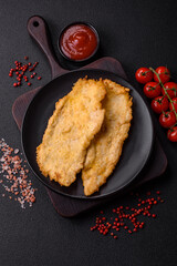Delicious juicy chicken chops in batter with salt, spices and herbs